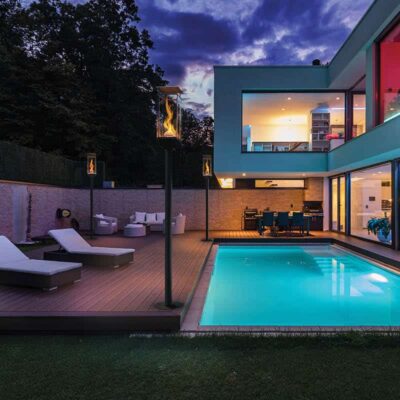 Modern villa with colored led lights at night. Nobody inside